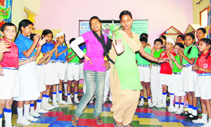Students take part in a function to mark the Labour Day at Asmah School in Mohali on Wednesday.