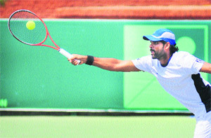Vishnu Vardhan in action during a doubles match at the CLTA, Sector 10, Chandigarh, on Wednesday. 