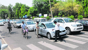  Police officials regulate traffic in the school lane in Sector 26.