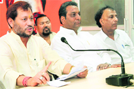Uttarakhand BJP chief Teerath Singh Rawat and newly elected Dehradun Mayor Vinod Chamoli addressing a press conference in Dehradun on Wednesday.