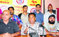 Members of the Jalandhar Cable Operators Welfare Society address the media on Wednesday.