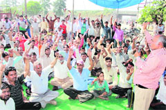 Members of the Joint Action Committee of the National Trade Unions protest for the acceptance of their demands on Labour Day in Jalandhar on Wednesday. 