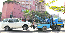 An SUV being towed away during an anti-encroachment drive held in the Ferozepur Road service lane in Ludhiana.