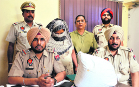 The accused woman in police custody in Ludhiana on Wednesday.