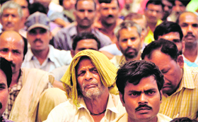 Workers attend a rally at Chatar Singh Park in Ludhiana on Wednesday.