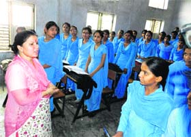 Education Minister Geeta Bhukkal interacts with students during an inspection of Government Girls Senior Secondary School in Jhajjar