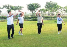 A group of doctors work out at a park of Alfa City township on a Hisar road in Fatehabad