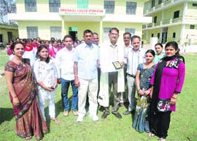 Dr Uma Shanker Yadav (fifth from left) being felicitated during a samman samaroh at Swaranjali School of Education in Rewari