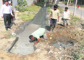 Punjab Pollution Control Board officials get the common outlet for the discharge of the untreated waste of the tanneries at the Leather Complex connected with a storm water sewerage plugged