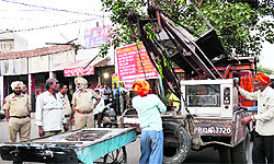 Encroachments being removed at Gole Market in Ludhiana on Thursday