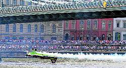 Hungarian aerobatics pilot and European champion air racer Zoltan Veres flies his aircraft upside down under Chain Bridge, the oldest Hungarian bridge, on the Danube in Budapest on Wednesday