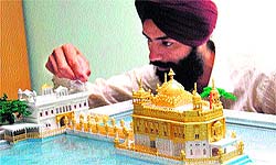 Paper artist Gurpreet Singh with his creations in Amritsar