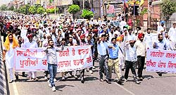 MGNREGA workers take out a protest rally against the government in Bathinda on Friday