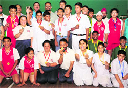 Winners of the Special Children State Badminton Meet in a jubilant mood after the award ceremony at Sector 4 in Chandigarh on Friday. Tribune Photo: Parvesh Chauhan