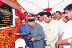 Chief Minister Virbhadra Singh lays the foundation stone of a bridge on the Lander Khad in the Chintpurni constituency of Una district on Thursday. 