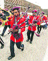 Sanaullah (in circle) played bagpipes with perfection