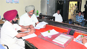 Staff deputed in the court room of Tehsildar to receive nomination papers for the Zila Parishad and Block Samiti elections in Jalandhar on Friday.