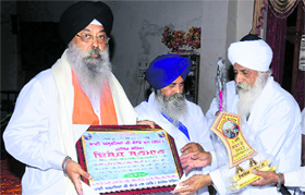 Members of the Bhai Ghanaiya Charitable Society felicitate Amarjit Singh Anand in Jalandhar.