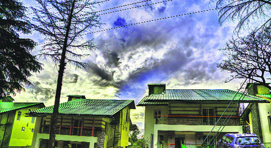 Clouds form a colourful canopy over the Norwood Greens in Palampur, Himachal Pradesh