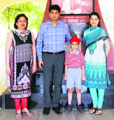 Agamveer, who has won the State Cyber Olympiad and has a keen interest in the cyber world at a tender age, with his family in Amritsar.