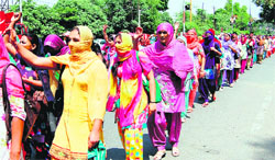 Members of the Special Trainer Teachers Union protest in support of their demands against the state government in Amritsar on Saturday. 