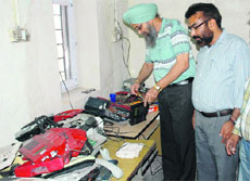 BSNL officials at the telephone repair workshop in Amritsar on Saturday.