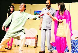 Artistes enact a scene from a play, Wohti and Wife Returns, at the Tagore Theatre in Chandigarh on Sunday