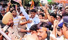 BSP activists protest against corruption in the system and the recent bribe case involving Vijay Singla in Chandigarh