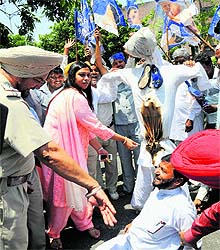 BJP activists protest at the road separating Sectors 33 and 34 on Saturday