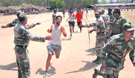 Candidates appear in a physical performance test.