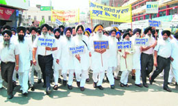 SGPC members protest against the acquittal of Sajjan Kumar in an anti-Sikh riots case in Amritsar on Saturday.