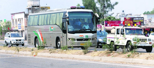  In view of security threat, the India-Pakistan bus is escorted by police vehicles as it crosses Rajpura on Saturday.