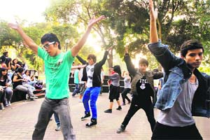 Peruvian fans of K-pop bands dance to their idols songs at a park in Lima