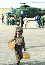 A soldier carries electoral material in the border town 