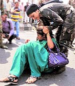 A protester being detained