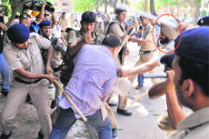 Activists of the ABVP being lathicharged by the police near Railway Minister Pawan Kumar Bansal's residence in Sector 28, Chandigarh, on Sunday. 