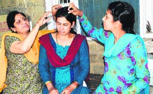 Third monkey attack victim Chanchal (centre).