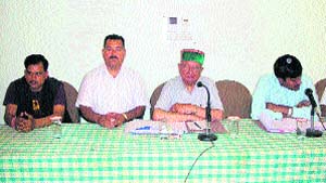 Brij Behari Lal Butail addresses the management of power projects in Palampur.