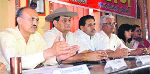 Members of the Toll Hatao Sangharsh Samiti address a press conference in Gurgaon on Sunday. 