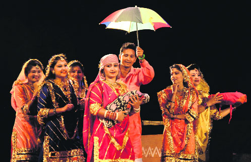 Artistes perform at Rangla Jammu on Sunday. 