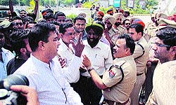 Members of the Valmiki community argue with police officials demanding a ban on the film, Shootout at Wadala, in Jalandhar on Sunday