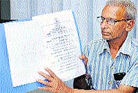 Former uncercover agent Upinder Nath shows a certificate lauding his work in Jalandhar