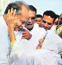 Rajasthan CM Ashok Gehlot being blessed by an elderly woman during the inaugration of Haj House for piligrim tour of Mecca Medina, in Jaipur on Sunday.