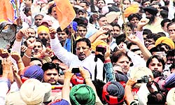 Industries Minister Anil Joshi along with his supporters