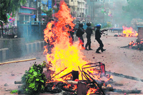 Bangladeshi police fires rubber bullets at demonstrators during clashes with Islamists in Dhaka on Sunday. Thousands of hardline Islamists demanding a tougher blasphemy law blocked major highways cutting off Dhaka from the rest of the country.