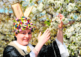 The new blossom queen Carolina Sofia Wolf in Jork, northern Germany, on Sunday . For the past 30 years, the blossom queen is elected for representative duties of the Altes Land that is the biggest contiguous fruit-producing region in central Europe.