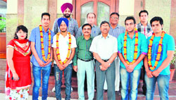 Students of the Department of Mass Communication and Video Production being felicitated by DAV College authorities in Amritsar on Tuesday. 