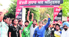Relatives of inmates protest outside Central Jail in Amritsar on Monday.