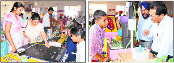 Visitors have a look at the models on display at the Inspire Awards exhibition that began at Teachers Home in Bathinda on Monday.