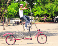 Rajiv rides his specially designed bicycle in Chandigarh on Monday